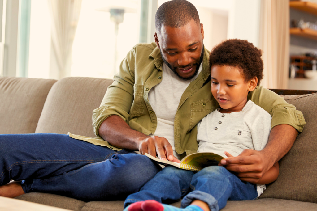father reading with son